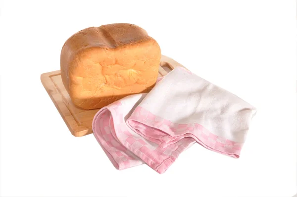Het brood van brood en handdoek leggen aan boord — Stockfoto