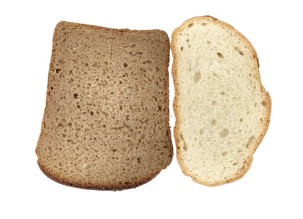 Stukken van witte en zwarte brood — Stockfoto