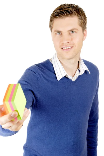 Business man holding a pack of post its. — Stock Photo, Image