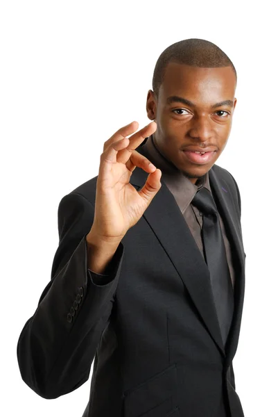 Hombre de negocios gesticulando bien — Foto de Stock