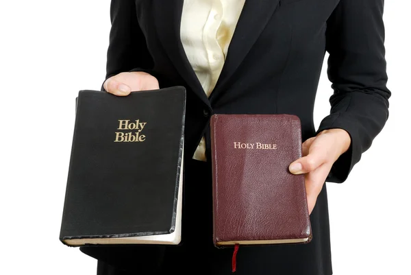 Business woman holding two bibles — Stock Photo, Image