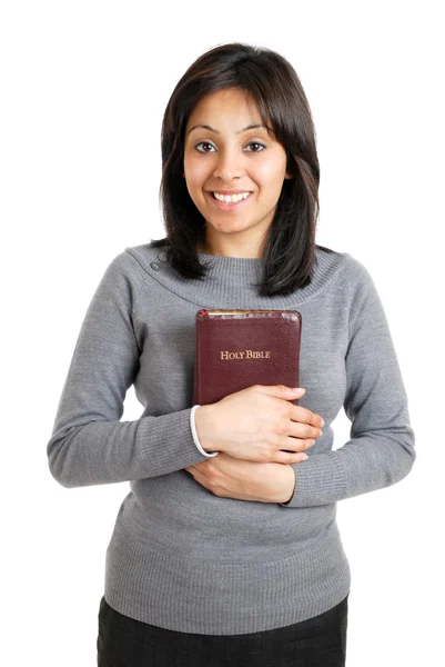 Mujer joven sosteniendo una biblia mostrando compromiso — Foto de Stock