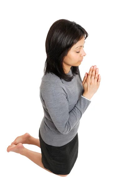 Business woman kneeling and praying — Stock Photo, Image