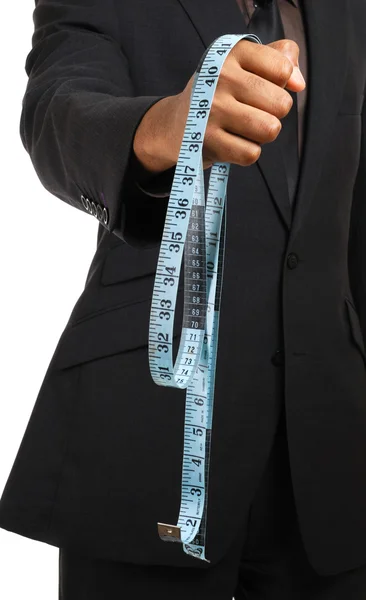 Business man offering a measuring tape — Stock Photo, Image