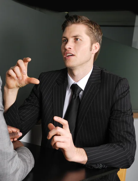 Caucasian business man having a discussion — Stock Photo, Image