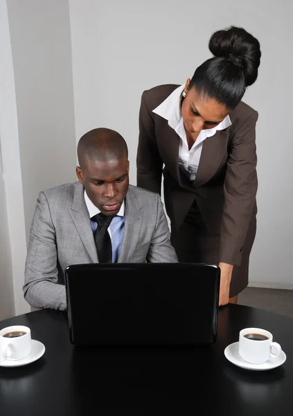 Multi-ethnic business team working on laptop — Stock Photo, Image