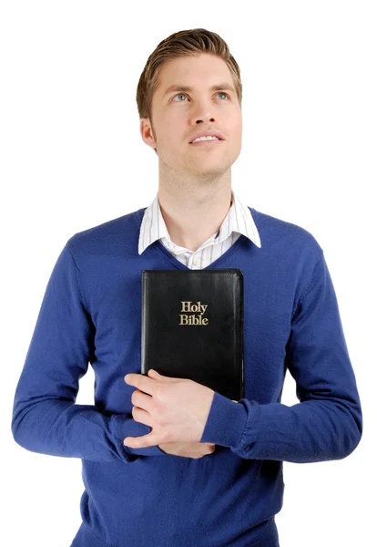 Uomo con una bibbia che mostra impegno — Foto Stock