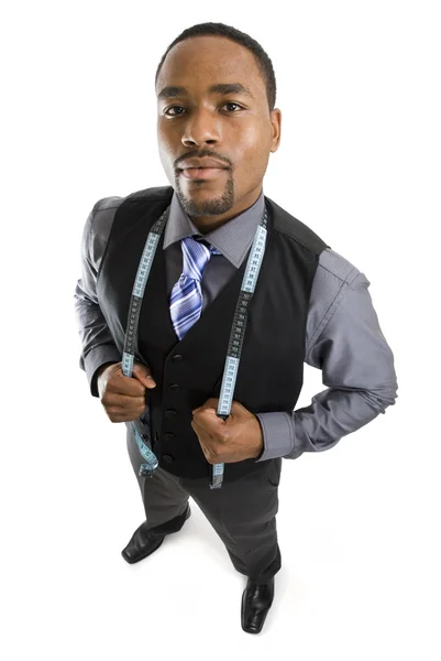 Homme d'affaires afro-américain utilisant un ruban à mesurer — Photo