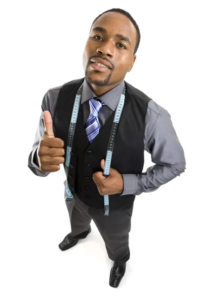 Hombre de negocios afroamericano usando una cinta métrica —  Fotos de Stock