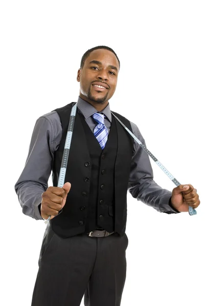 Africano americano homem de negócios usando uma fita métrica Imagens Royalty-Free