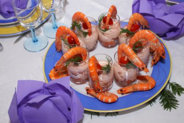 Plate of shrimp and salmon mousse in glasses clipart