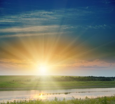 Good sunset over field and river clipart