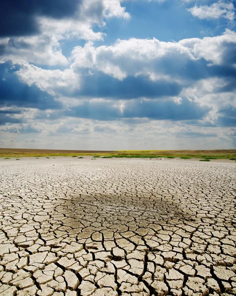 Cracked earth under dramatic sky Stock Image