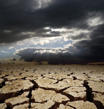 Dramatic sky and drought earth clipart