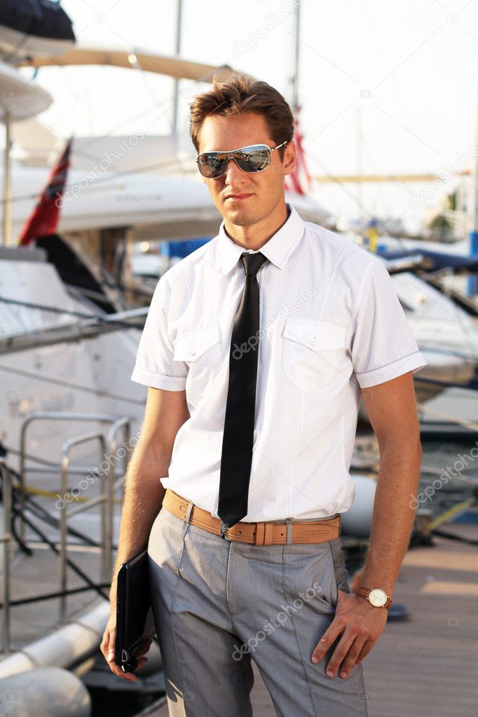 Business professional man over yacht outdoors background