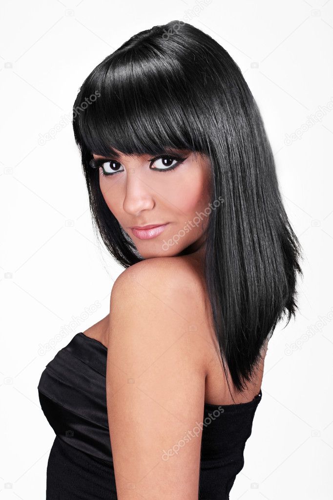Portrait of beautiful young woman with straight black hair posin