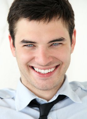 Closeup portrait of Happy smiling young man clipart