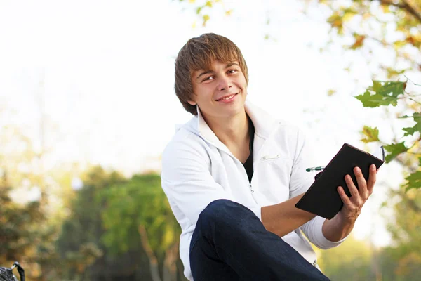 Closeup of a happy young man outdoors portrait Stock Image