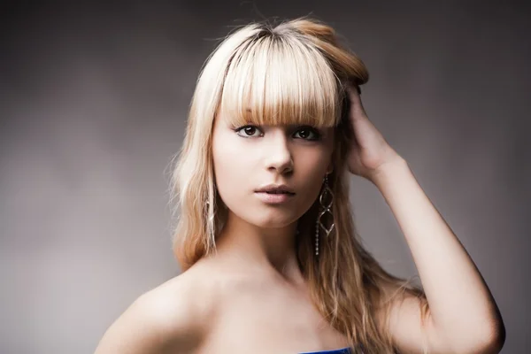 stock image Beautiful young girl over gray background