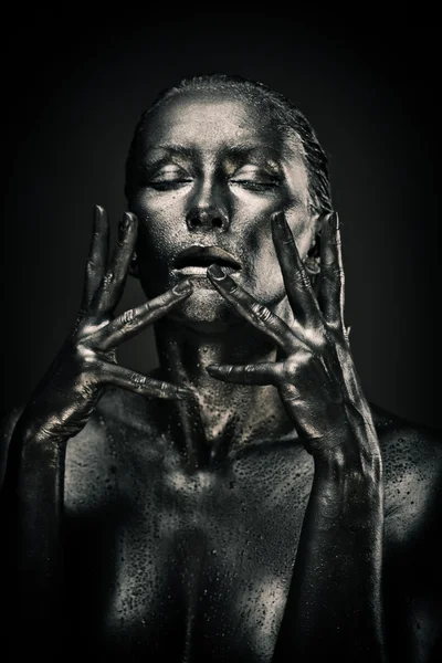 Nude woman like statue in liquid metal — Stock Photo, Image
