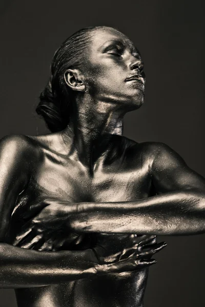 Nude woman like statue in liquid metal Royalty Free Stock Images