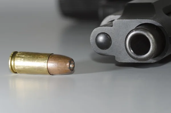 Bullet and gun barrel — Stock Photo, Image