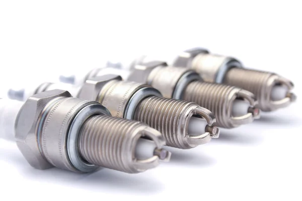 Four spark plugs for car's engine — Stock Photo, Image