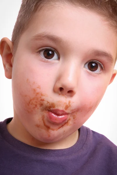 Boy eat chocolate — Stock Photo, Image
