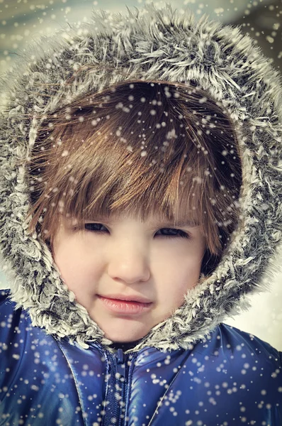 Beautiful little girl with fur hood in the snow — Stock Photo, Image