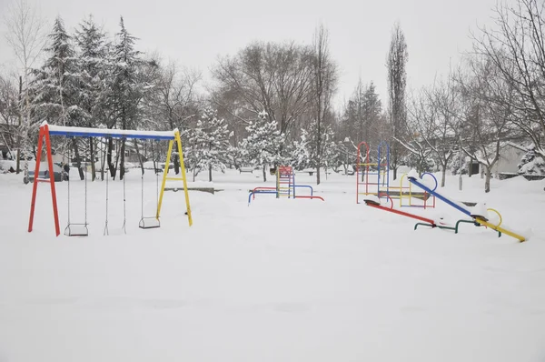 Stock image Empty playground covered with snow