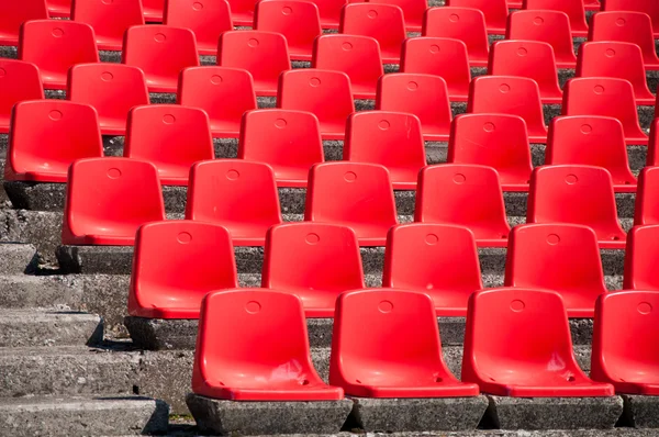 Red stadium seats on the stand — Stock Photo, Image