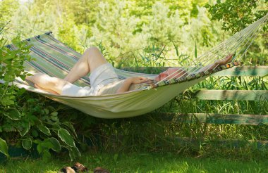 Relaxing in the hammock. clipart