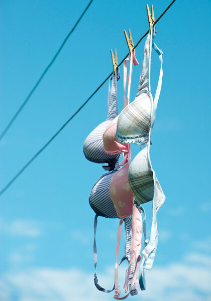Pretty bras drying on line.