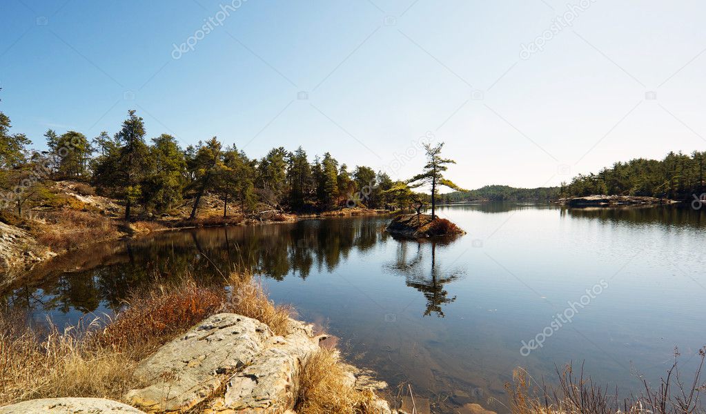 Lake with tiny islet in Spring.