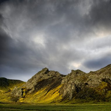 Mountains with dramatic sky clipart