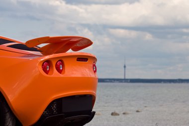 TALLINN, ESTONIA - JUNE 16, 2008: An orange Lotus Exige S rear d clipart