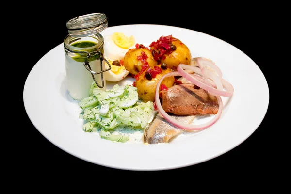 Herring with boiled potatos and cucumber salad — Stock Photo, Image