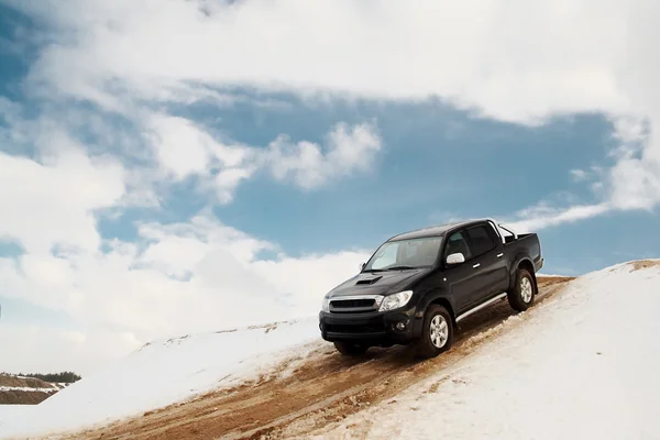 stock image Pickup truck driving down the hill