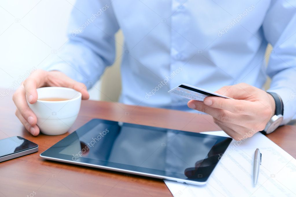 Man using a credit card for online shopping