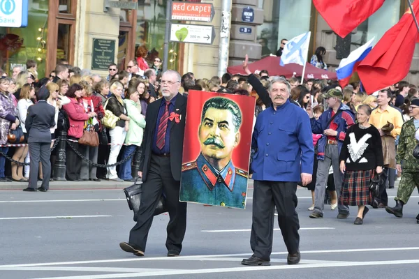 Two Communist have a portrait of Stalin — Stock Photo, Image