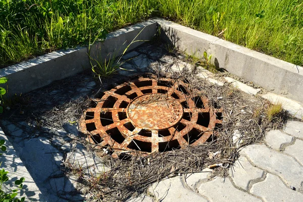 stock image OLd rusty manhole cover