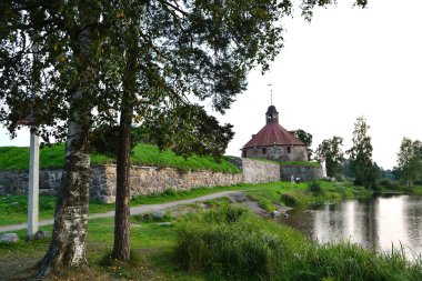 Old Korela fortress at evening clipart