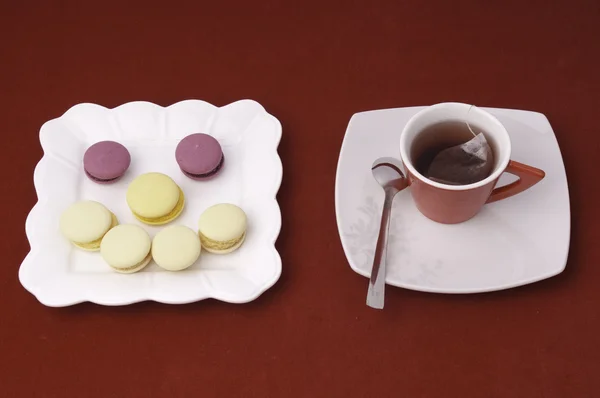 Cup of tea and smile of macaroons on a velvet tablecloth (3) Stock Photo
