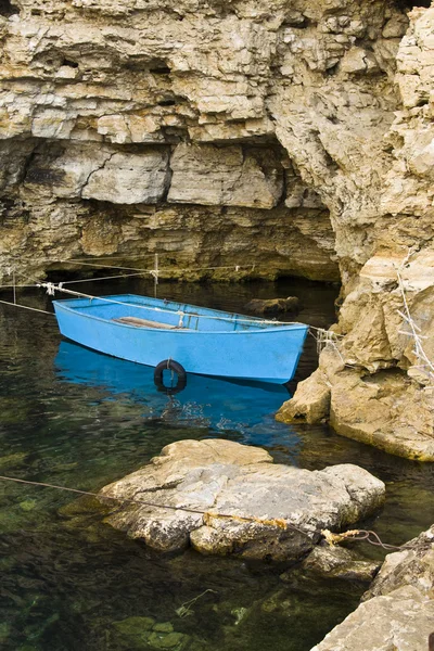 stock image Boat in rocks