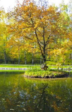 Autumn landscape with red tree clipart