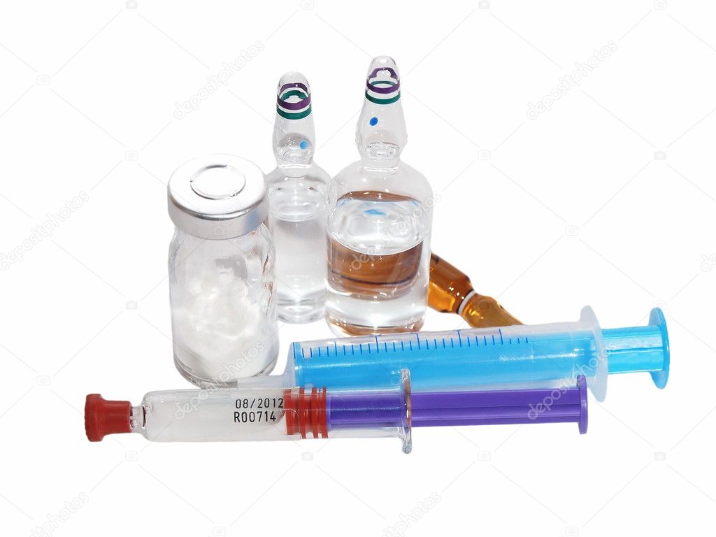 Medicine vials and syringe isolated on white background