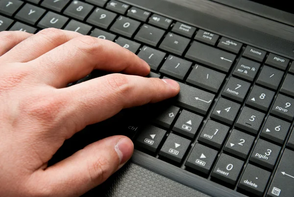 stock image Finger pressing laptop