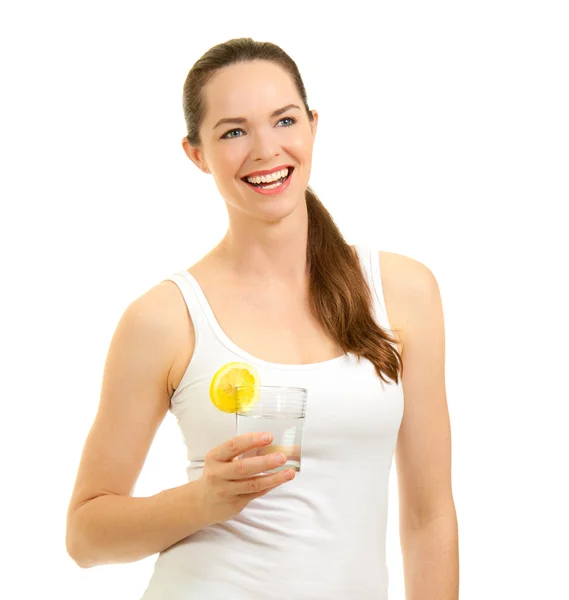 Beautiful woman laughing and holding glass of water — Stock Photo, Image