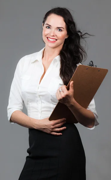 Successful woman with clipboard — Stock Photo, Image