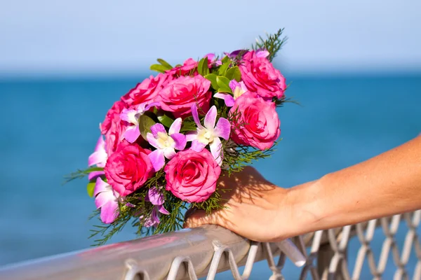 Beautiful wedding bouquet held by bride — Stock Photo, Image